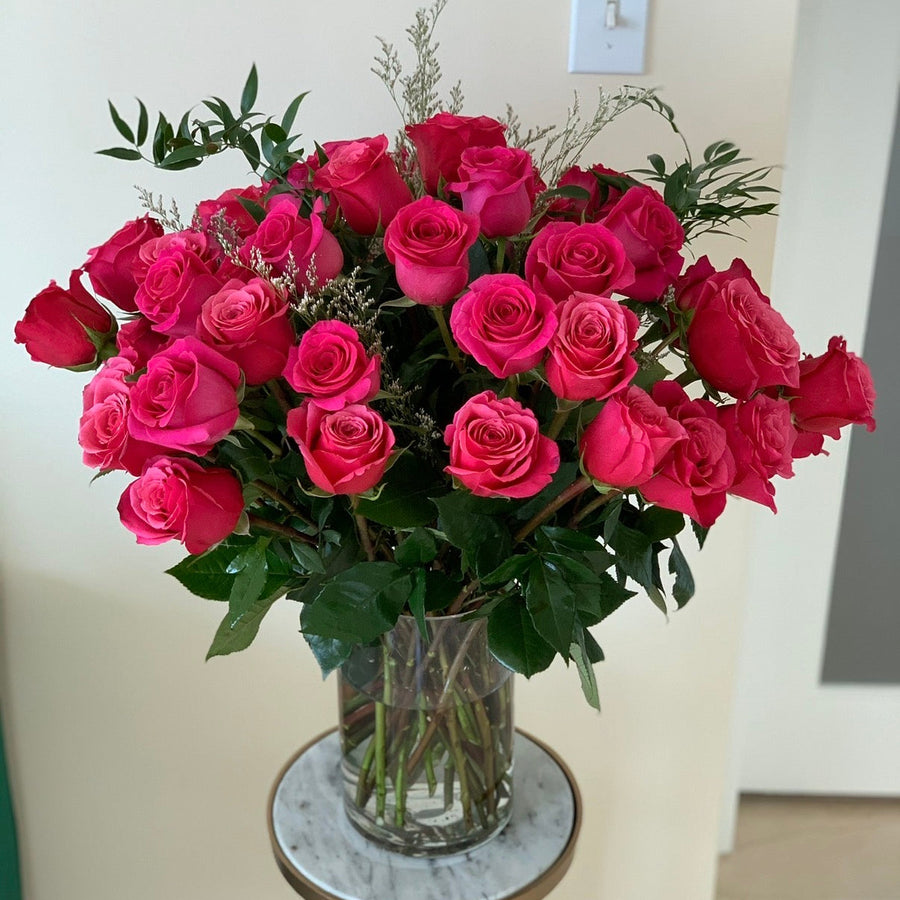 50 premium roses in a vase