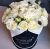 white roses in a box