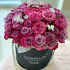garden roses, purple roses in a hatbox