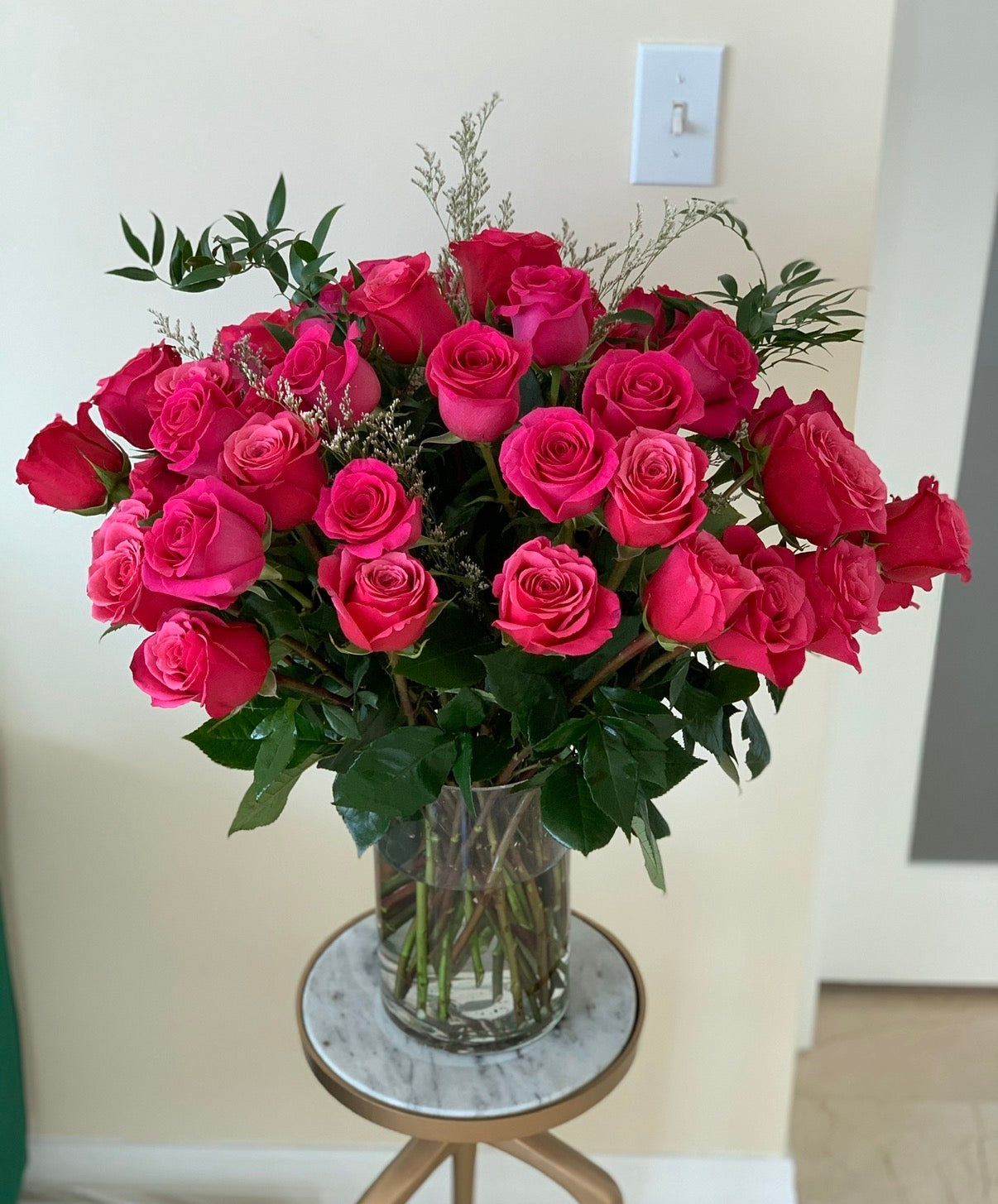 50 premium roses in a vase
