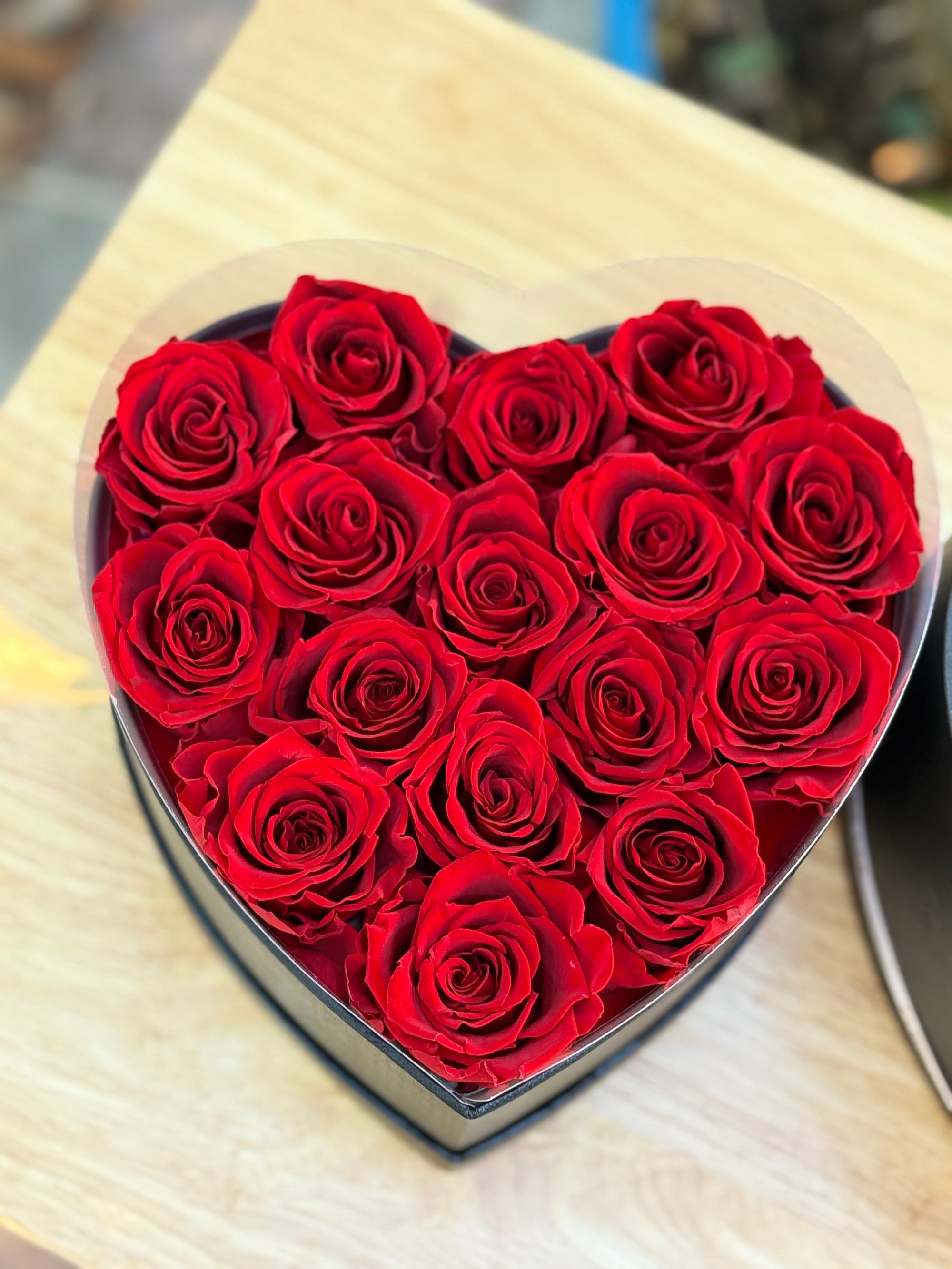 The box with 16 preserved forever long lasting roses