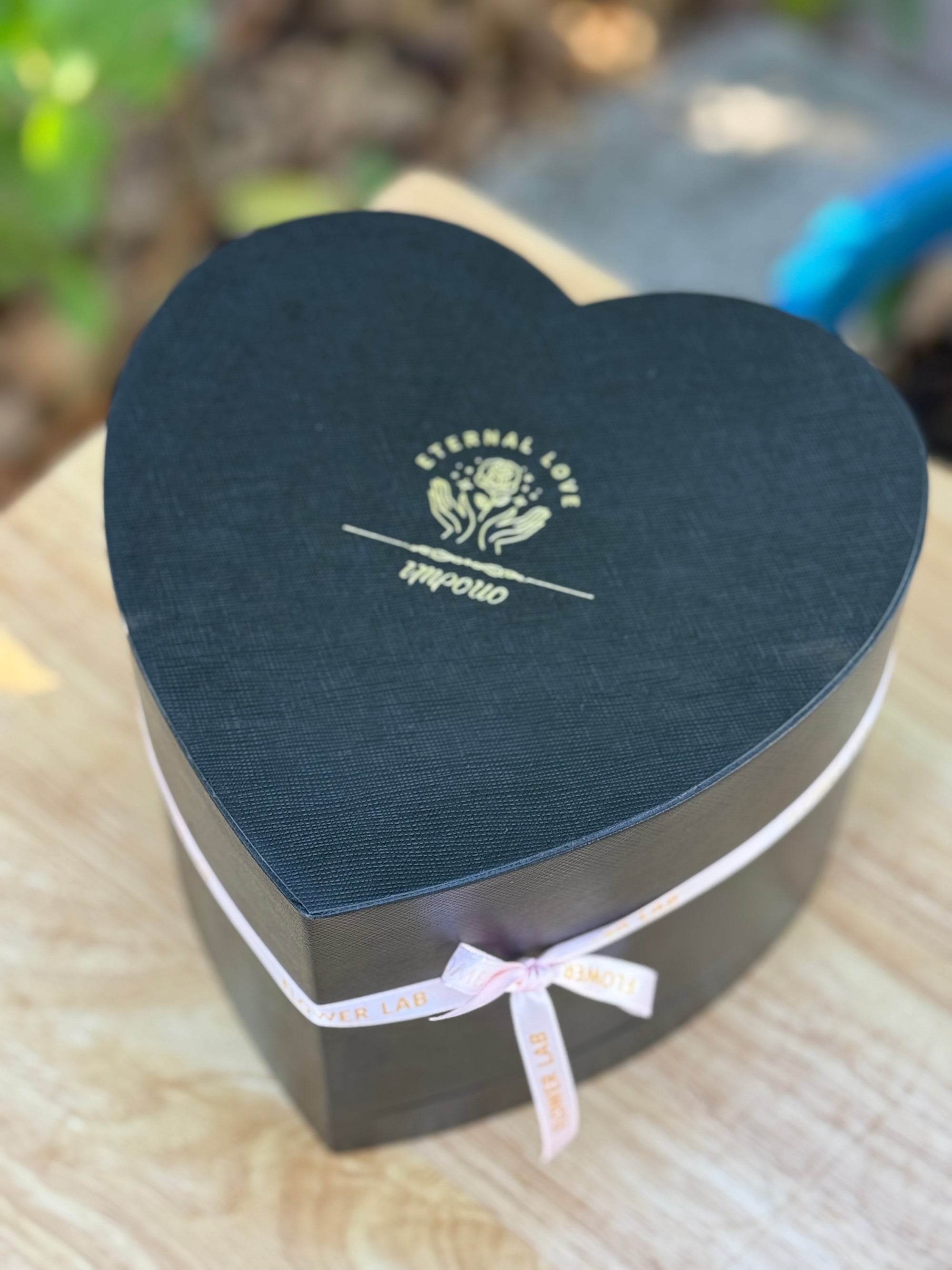 The box with 16 preserved forever long lasting roses