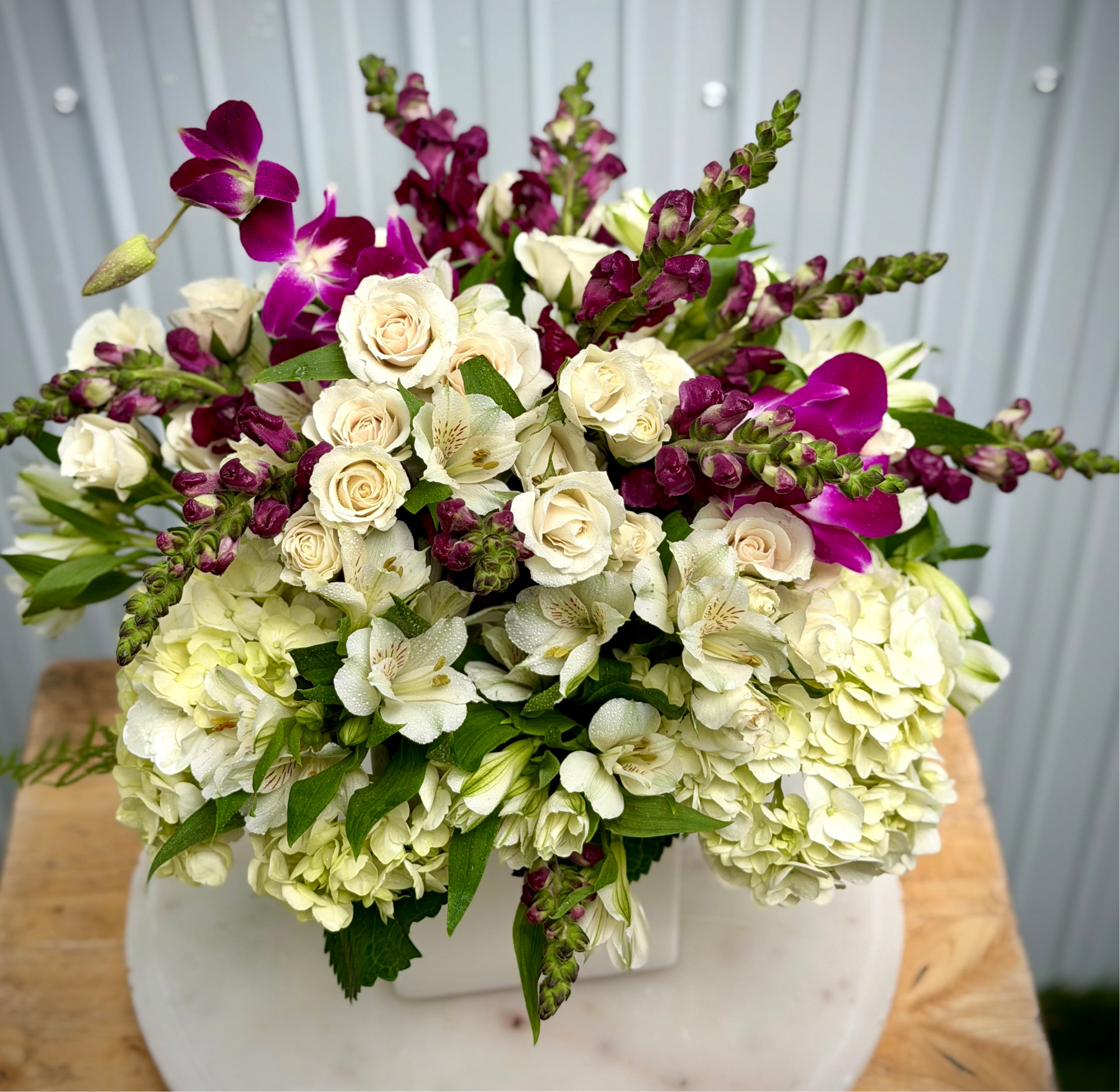 A1 Florist choice in a white ceramic vase
