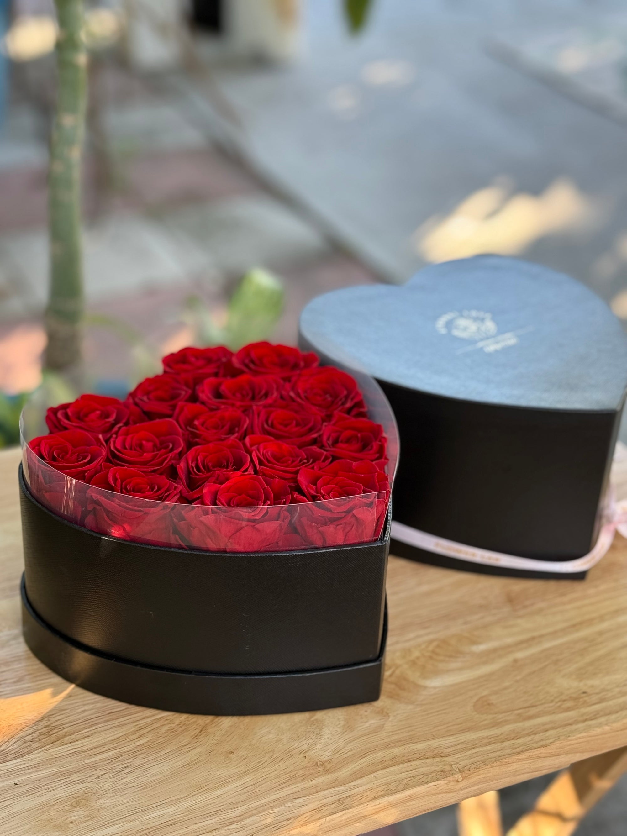 The box with 16 preserved forever long lasting roses