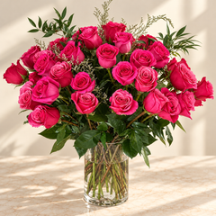 50 premium roses in a vase
