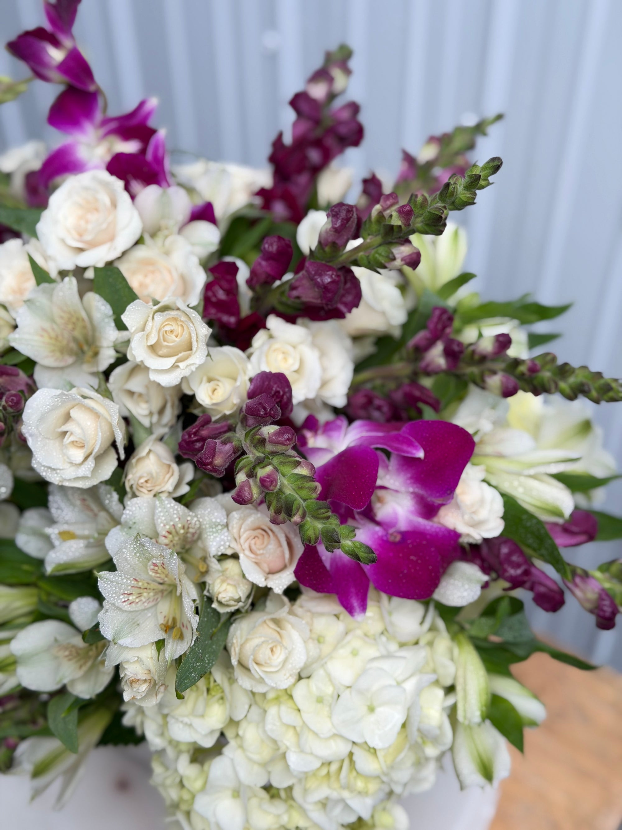 A1 Florist choice in a white ceramic vase