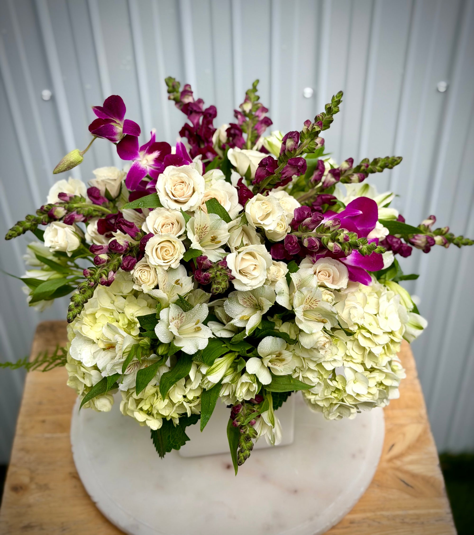 Florist choice in a white ceramic vase