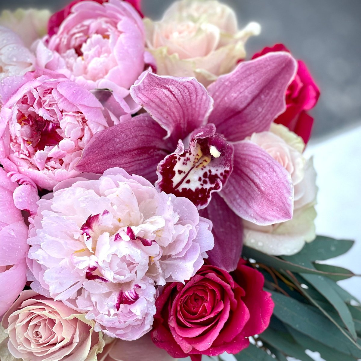 Luxury bouquet of pink roses, orchids, and peonies for same-day flower delivery in Bal Harbour, Sunny Isles, and Aventura