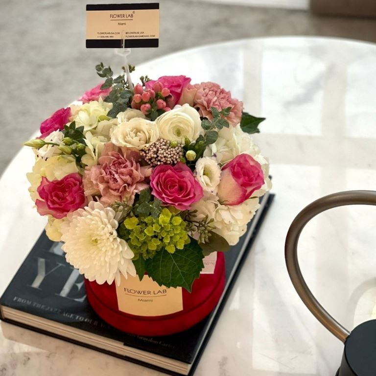 Bright flowers for a birthday girl. Ranunculuses, roses, unique flowers.