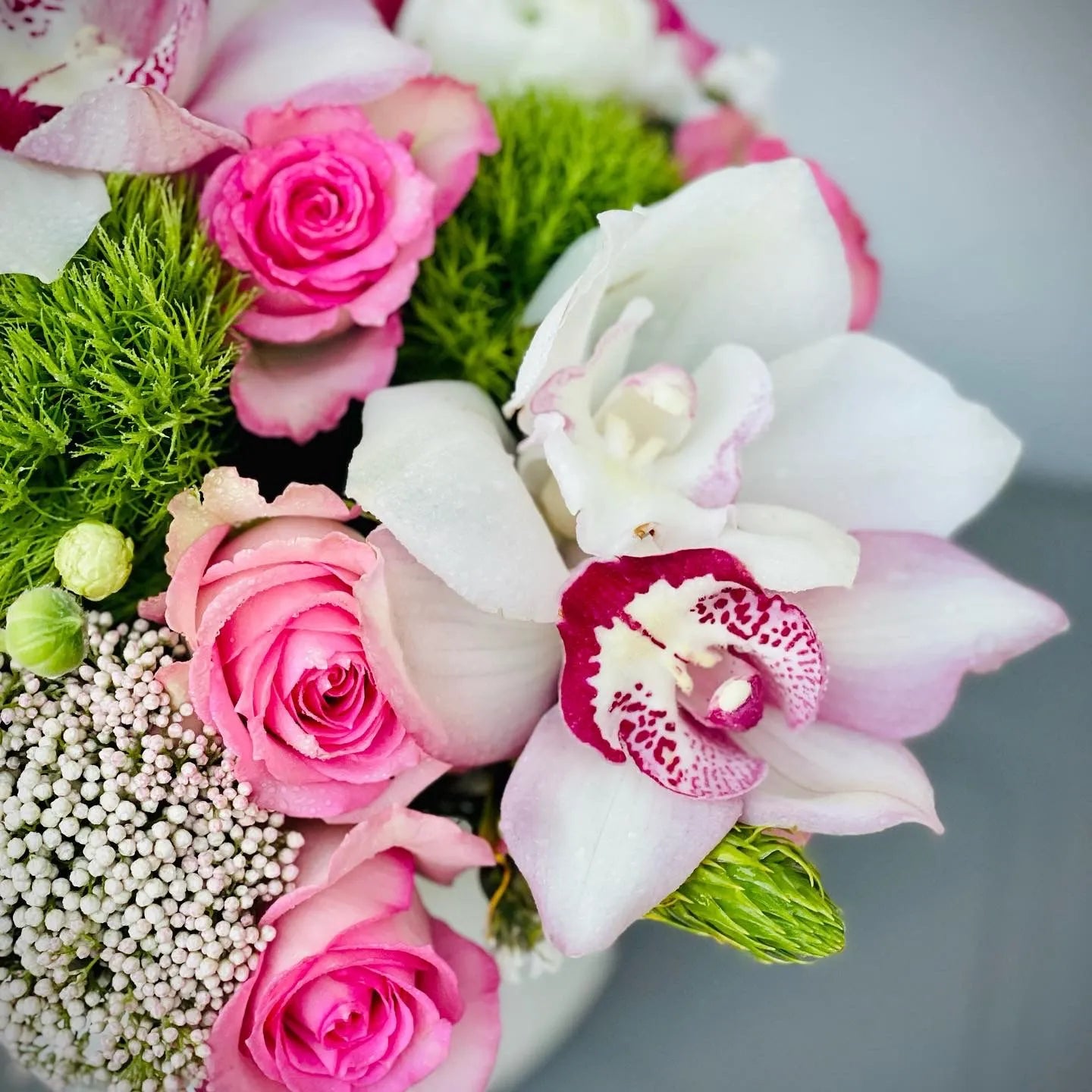 Florist Choice Flower Arrangement with Green Ball, Roses, Orchids