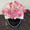 pink roses in a hatbox