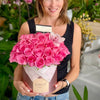 pink roses in a hatbox