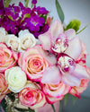 Perfecto Arrangement with Bicolor Roses Mini Roses, Cymbidium Orchids, Stock, Eucalyptus