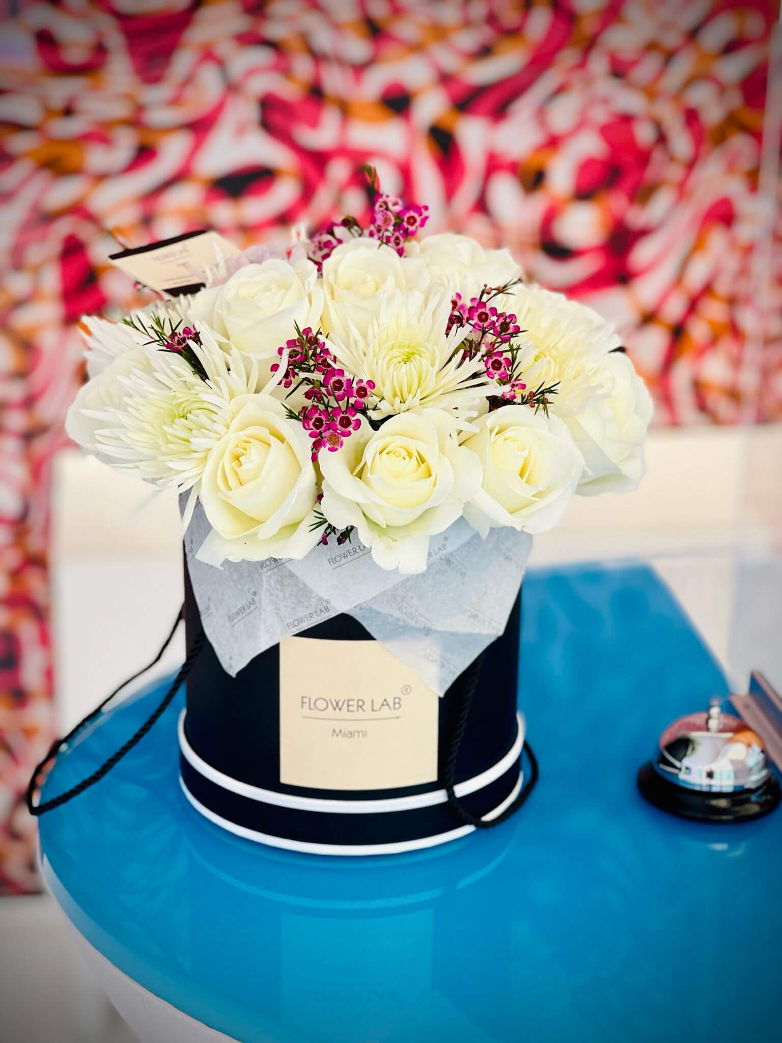 Sasha box with white roses, chrysanthemums and wax filler