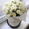 white roses in a hatbox