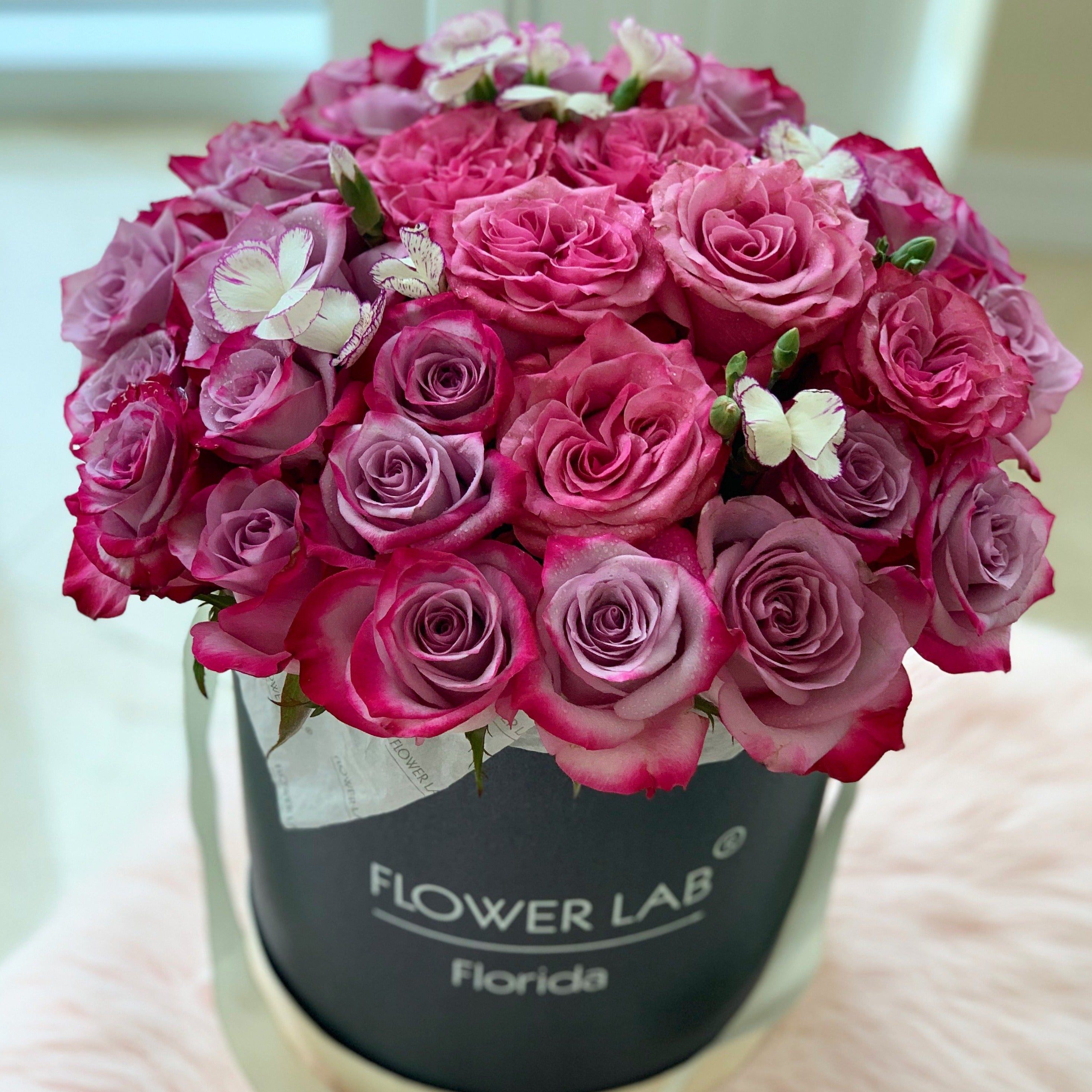 Lulu hatbox with purple and pink garden roses