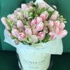 pink tulips in a hatbox