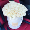 white roses in a flower hat box