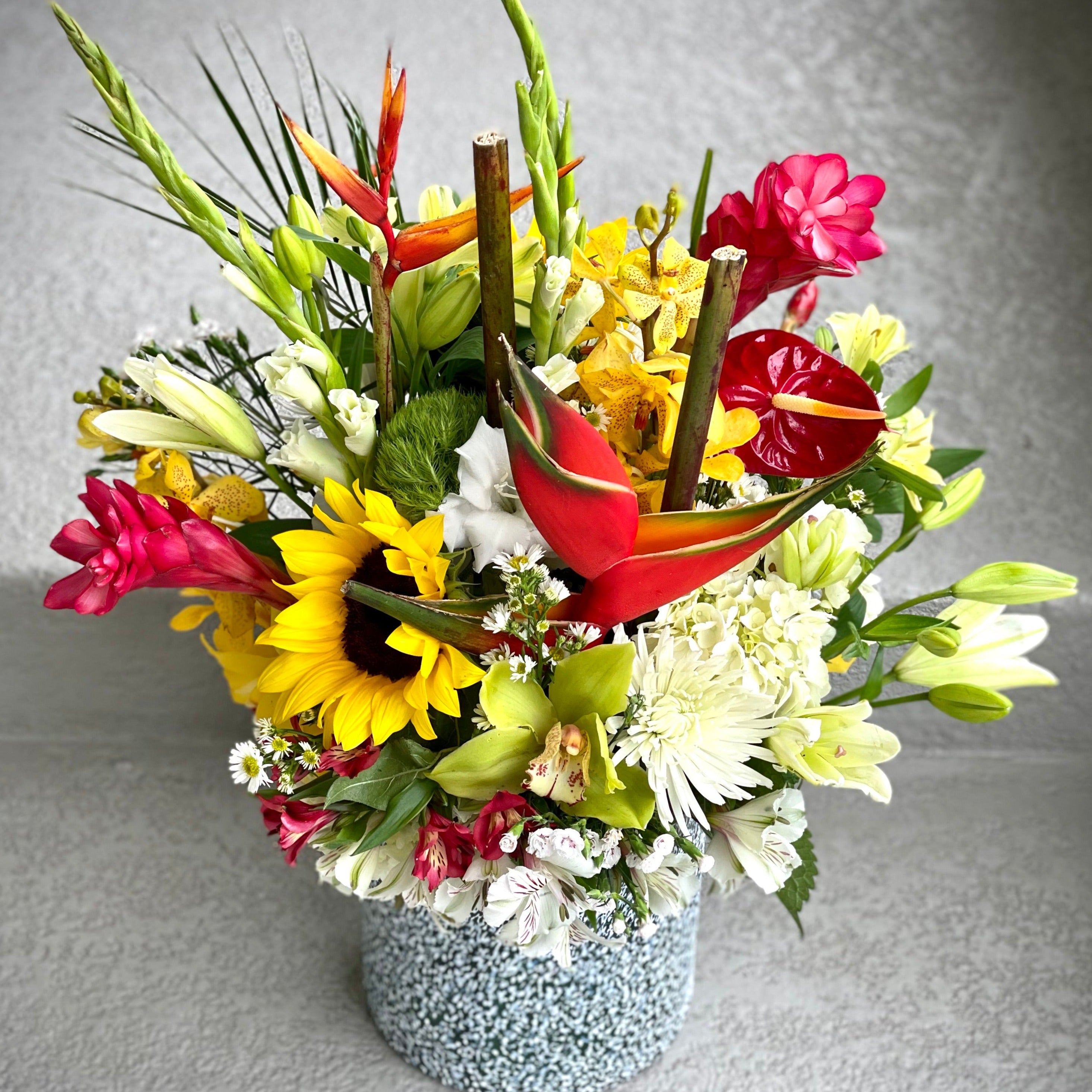 Tropical Florist choice arrangement in a vase