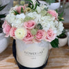 pink roses in a hatbox