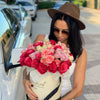 girl with hat box, red roses, pink mini roses