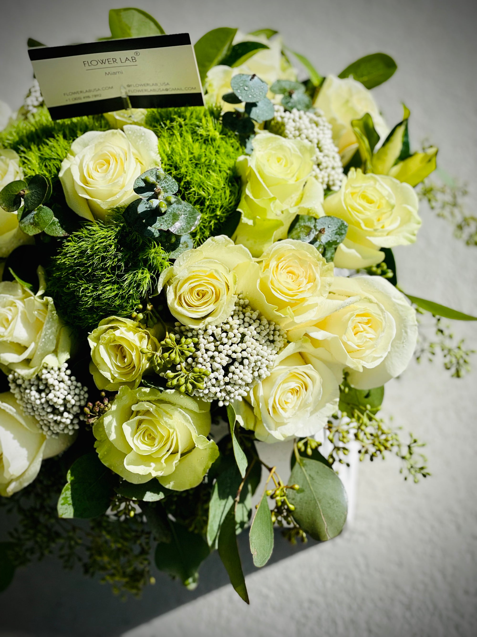 Earth tone flowers, whites and green roses. Best florist in bal harbour