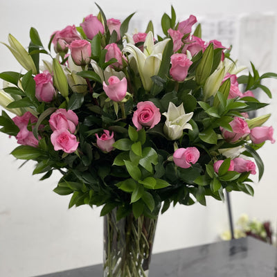 pink roses, lilies in a vase